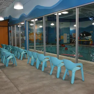 A waiting area for parents to view their children playing in the pool or having lessons.