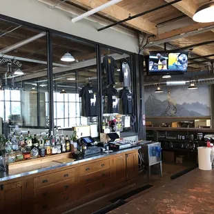 a bar with a large screen tv