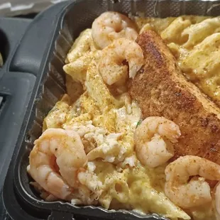 shrimp and macaroni in a pan