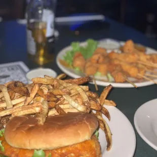 Spicy buffalo chicken sandwich shaken in golden medium sauce &amp; chicken skewers