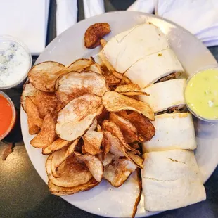 a plate of chips and a burrito