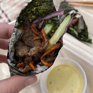 2 Pieces Bulgogi Handrolls (w/ a mustardy sauce)