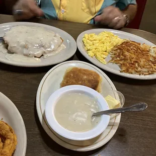 Chicken Fried Steak Breakfast with scrambled eggs, biscuits and hashbrowns