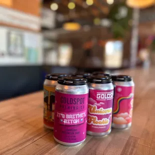 four cans of beer on a table