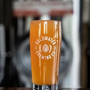 a glass of beer on a table