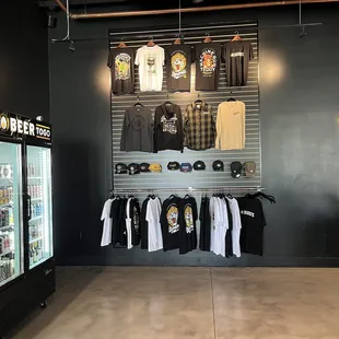 a display of t - shirts and other merchandise
