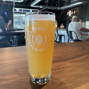 a glass of beer on a table