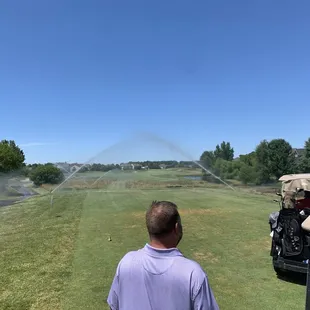 The sprinkles came on while we were preparing to tee off.  We got soaked.  The groundskeeper said he was trying to find a leak..