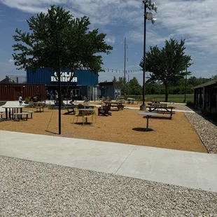 Sitting area could use some shade but comfortable chairs and yard games aplenty.