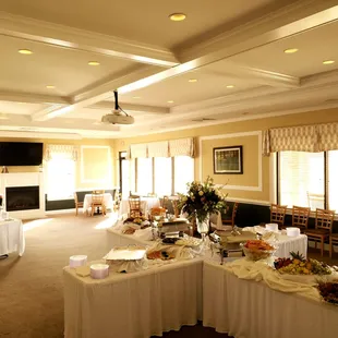 a banquet room with tables and chairs