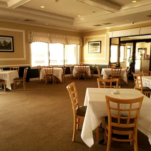 a dining room with tables and chairs