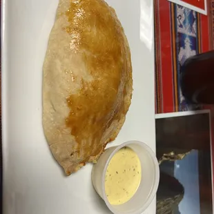 Empanada-chicken. Very good with a different dough--soft like biscuit.