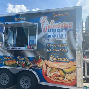a food truck parked in a parking lot