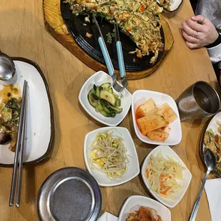 All the complimentary sides and scallion seafood pancake