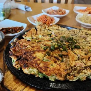 Full display with the seafood and scallion pancake appetizer.