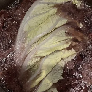 lettuce in the broth (take notice of the small black spots)