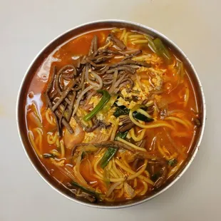 a bowl of soup with noodles