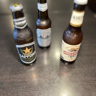 three bottles of beer on a table