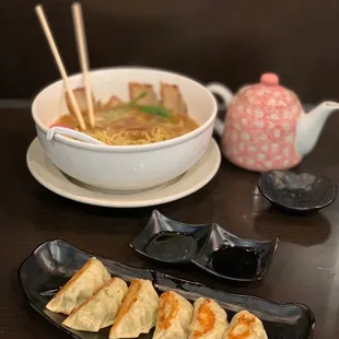 a plate of dumplings and a bowl of soup