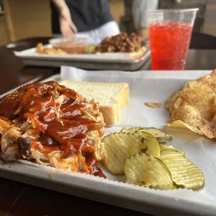 Here&apos;s the Pulled Pork Plate, pickle slices and a small portion of Broad Ripple chips