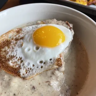 Biscuits and gravy with an egg