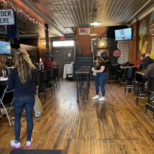 two people playing a game in a restaurant