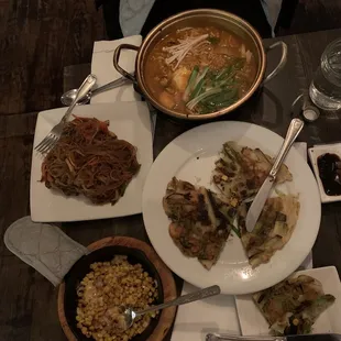 Japchae, Seafood Pancake, Spicy Seafood Ramen, and Korean Corn