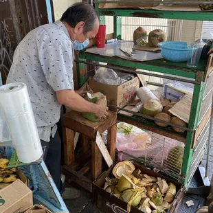 Coconut Man prepping the coconut!