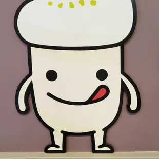 a cartoon character on a purple wall