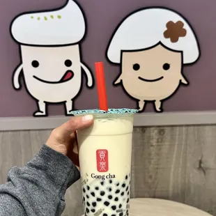 Peach Oolong Milk Tea Cold with boba and coconut jelly