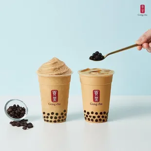 two cups of bubble tea with a spoon