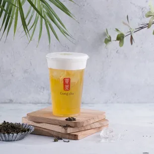a cup of tea and a tray of tea leaves