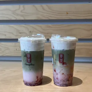 two cups of iced coffee on a table