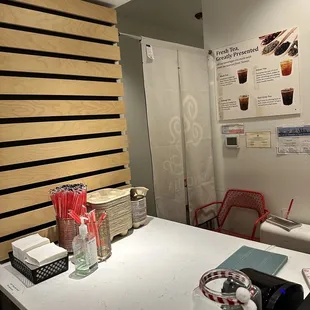 a coffee shop counter with a variety of items on it