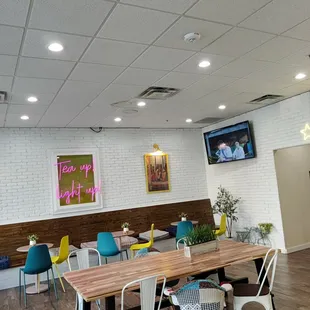 a dining area with tables and chairs