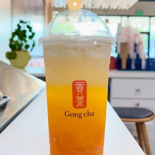 a cold drink in a plastic cup