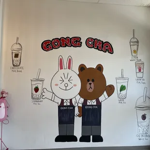 a mural of a bear and a cat