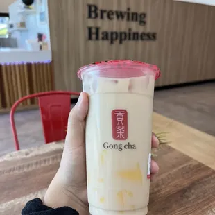 a person holding a cup of coffee