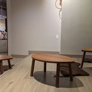 a coffee shop with tables and a clock