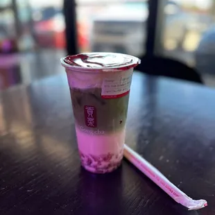 a plastic cup and a toothbrush on a table