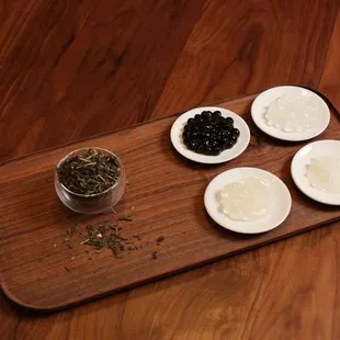 a variety of ingredients on a wooden tray