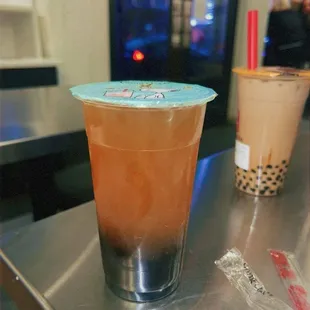 (Left) Lychee green tea w/ boba, (right) dirty brown sugar latte w/ boba.