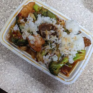 Combo platter with beef, chicken, and shrimp with veggies. A nice spicy sauce.