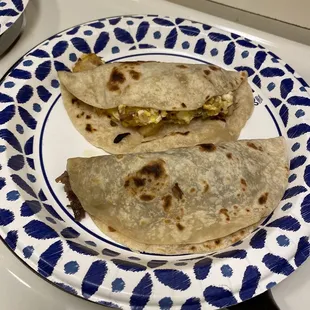 Barbacoa and a potatoe, bacon, w/egg tacos