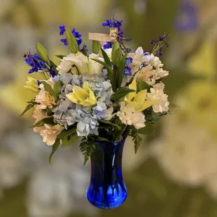 Blue vase sympathy arrangement