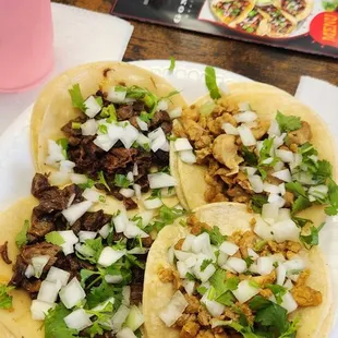 Two chicken and two asada tacos con todo
