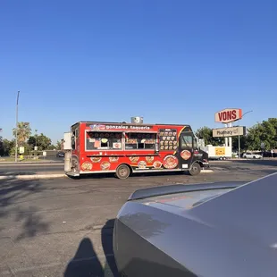 a taqueria truck in a parking lot