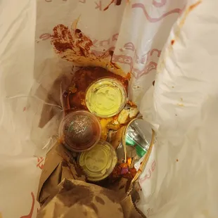 Burrito thrown away in garbage waste of food and money