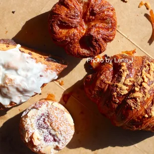 Kouign Amann ($4.25), Cinnamon Chip Scone ($5), Blueberry Jam Financier ($3.75), Ham &amp; Cheese Croissant ($6)