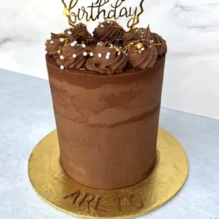 Amazingly delicious, 4 layer, super chocolatey, allergen-free cake. Half of this tall cake stuffed 8.